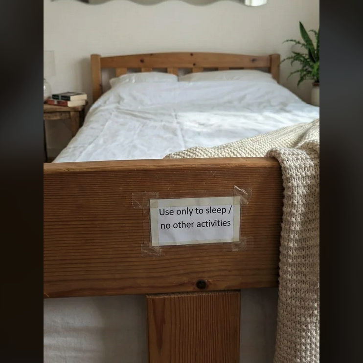 a sign on a bed