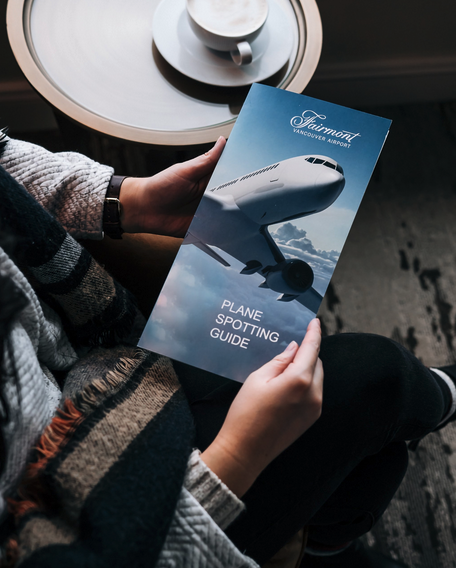 a person holding a brochure