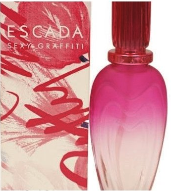 a bottle of perfume next to a box