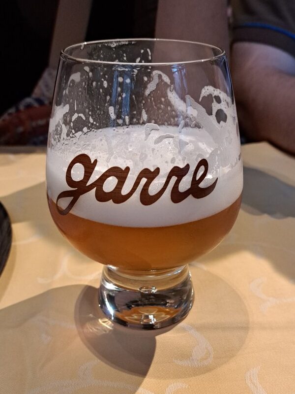 a glass of beer on a table