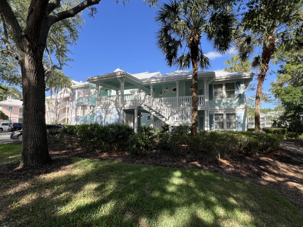 a building with trees and grass