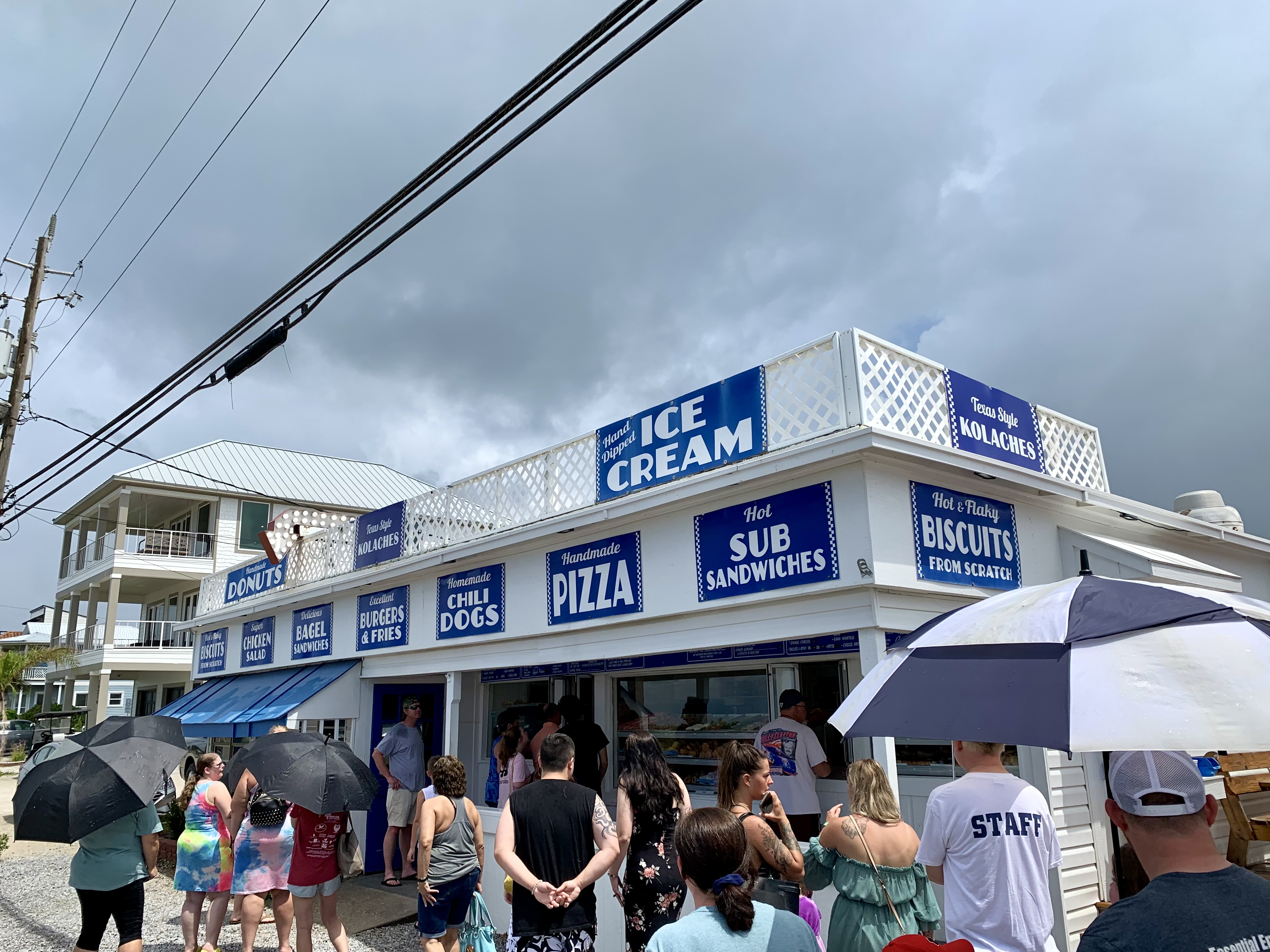 a group of people standing outside of a building