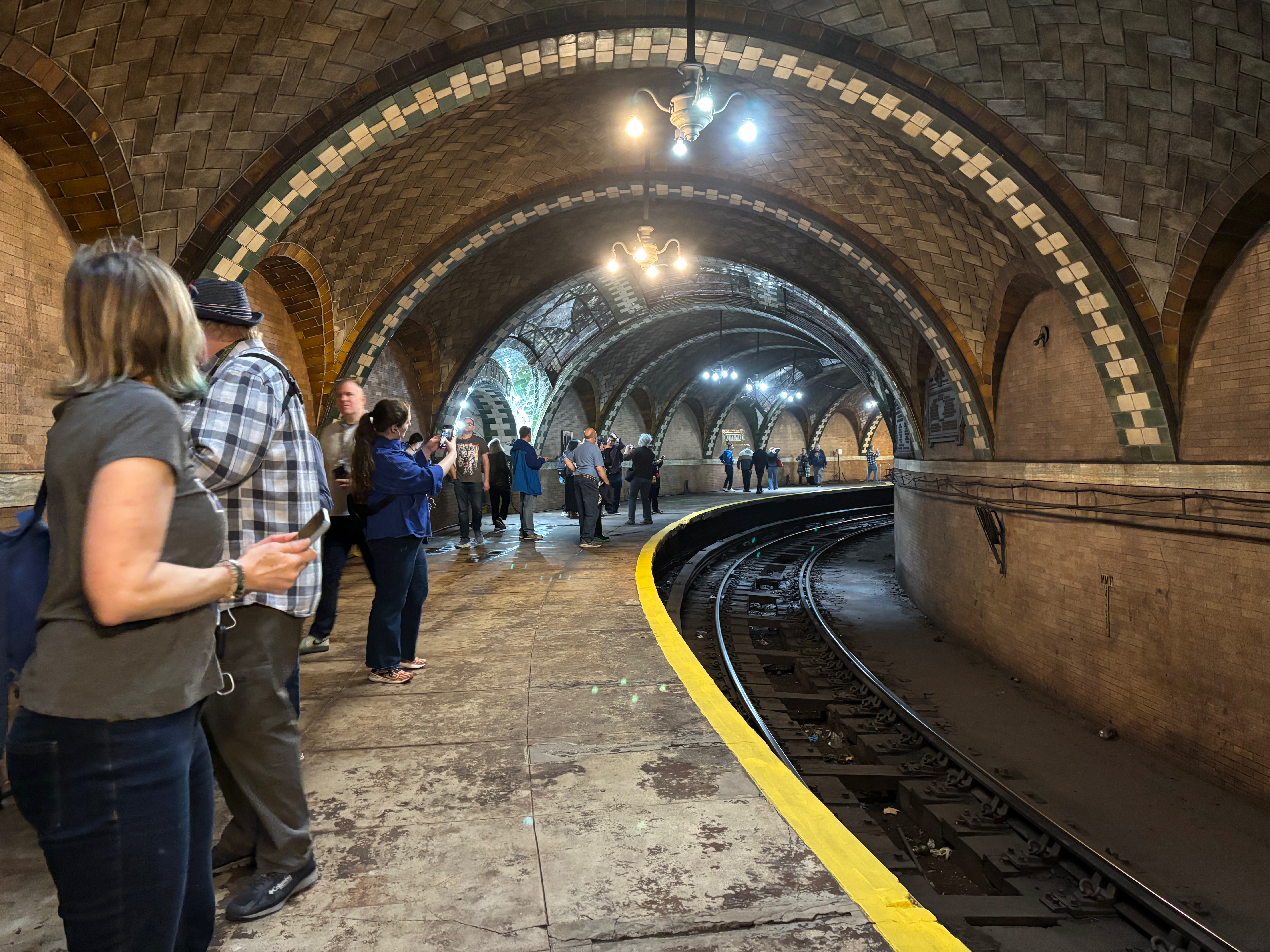a group of people standing in a tunnel