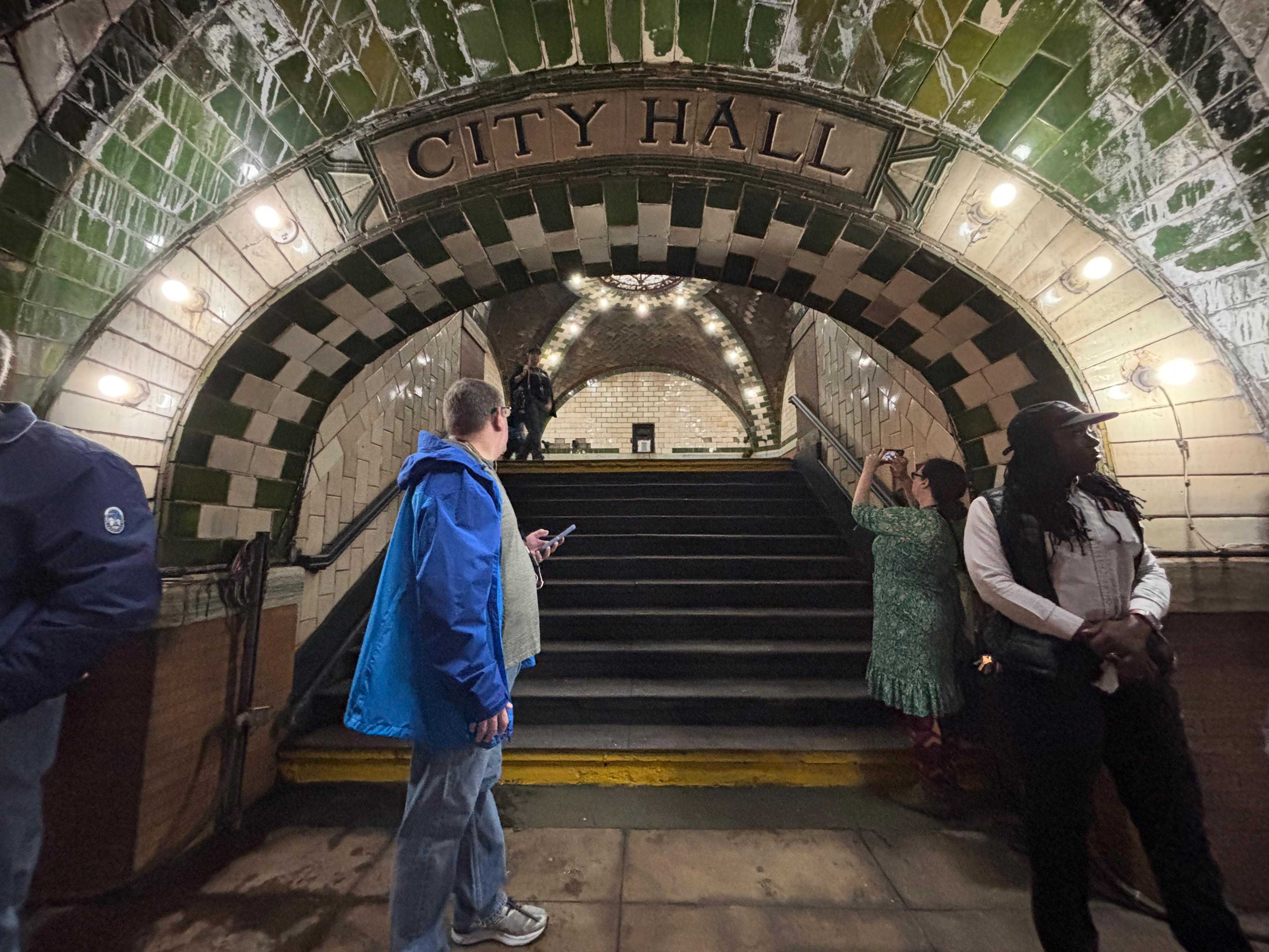 people standing in a tunnel