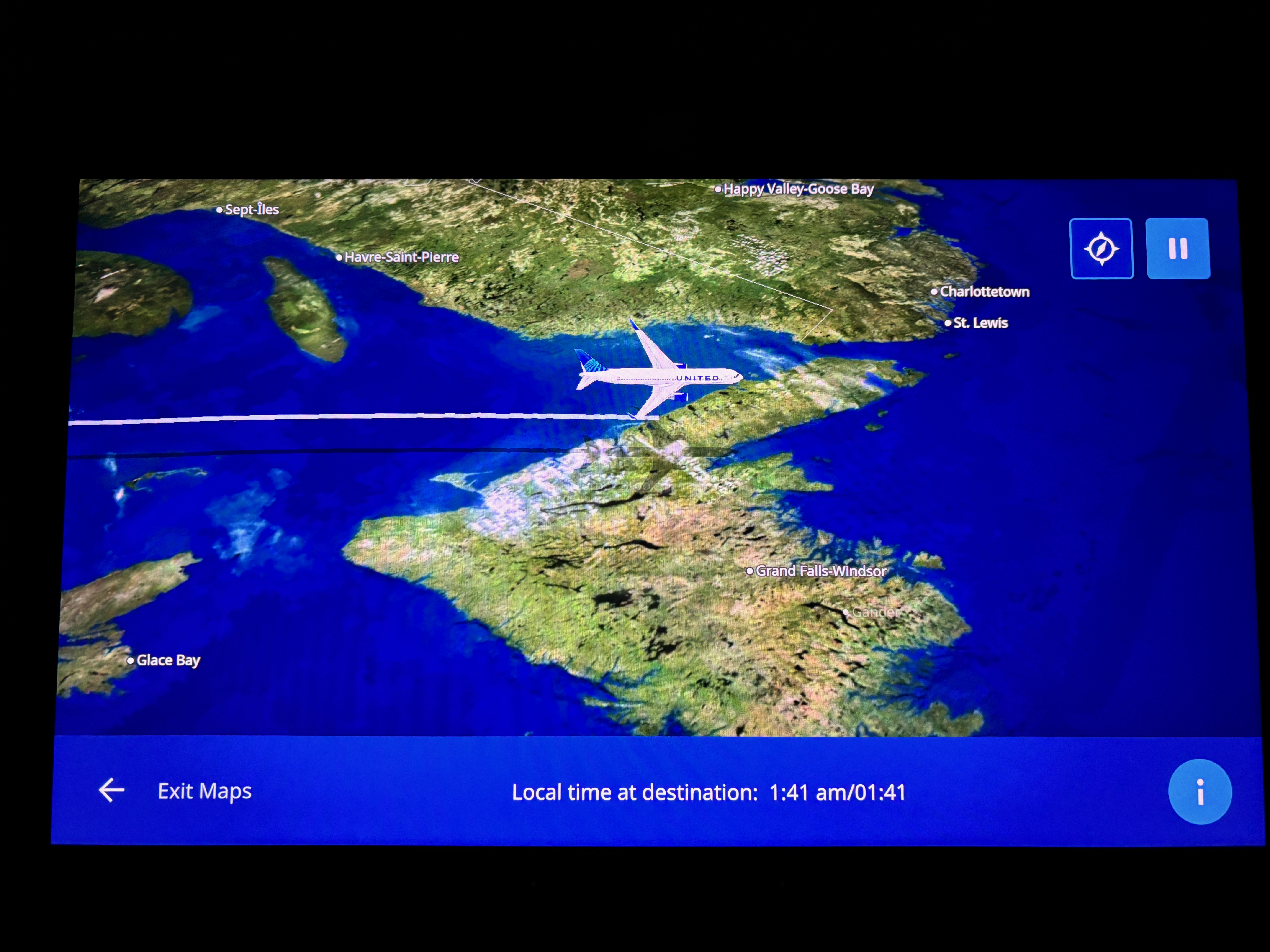 Flight map display showing a plane icon over land