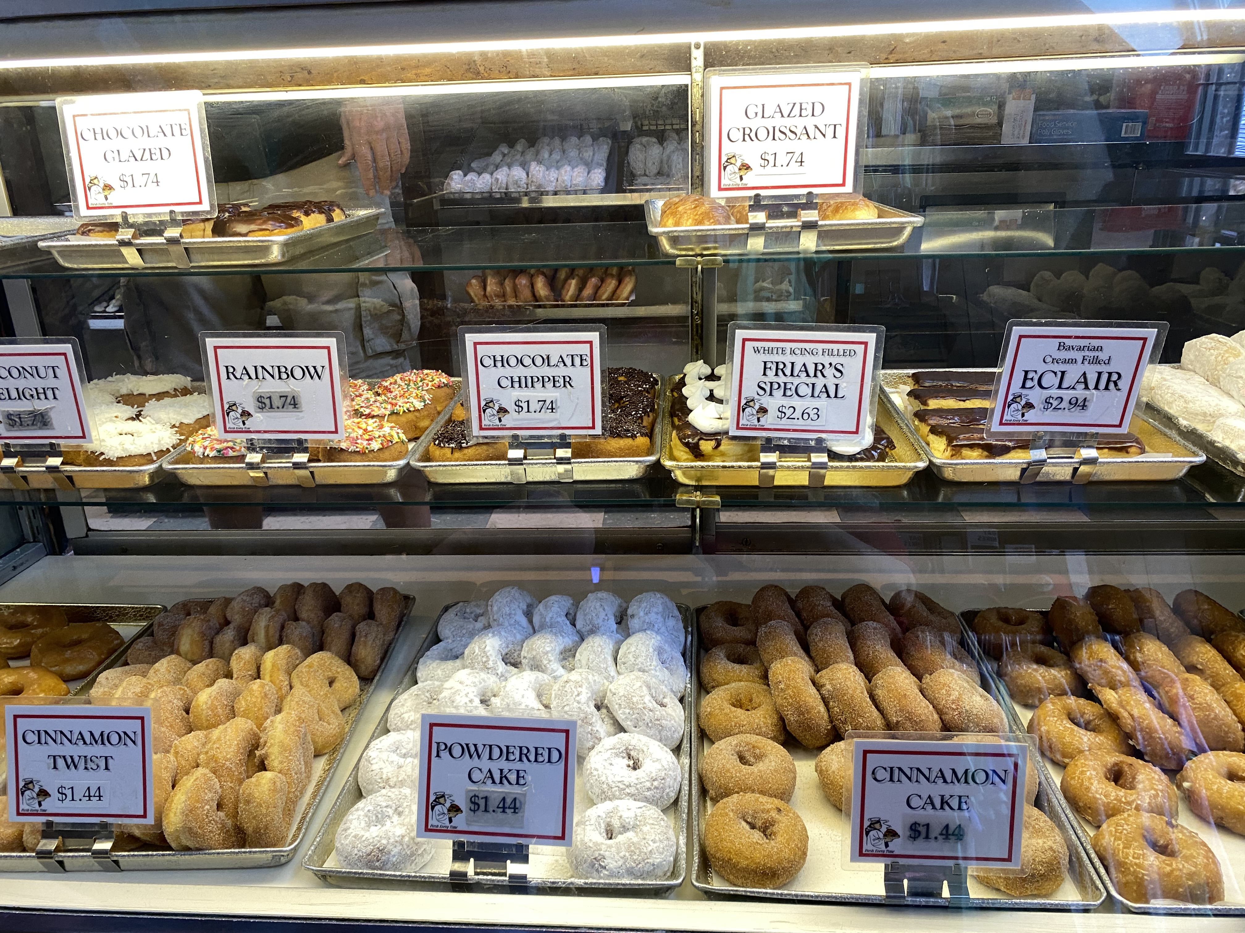 a display case with different types of donuts