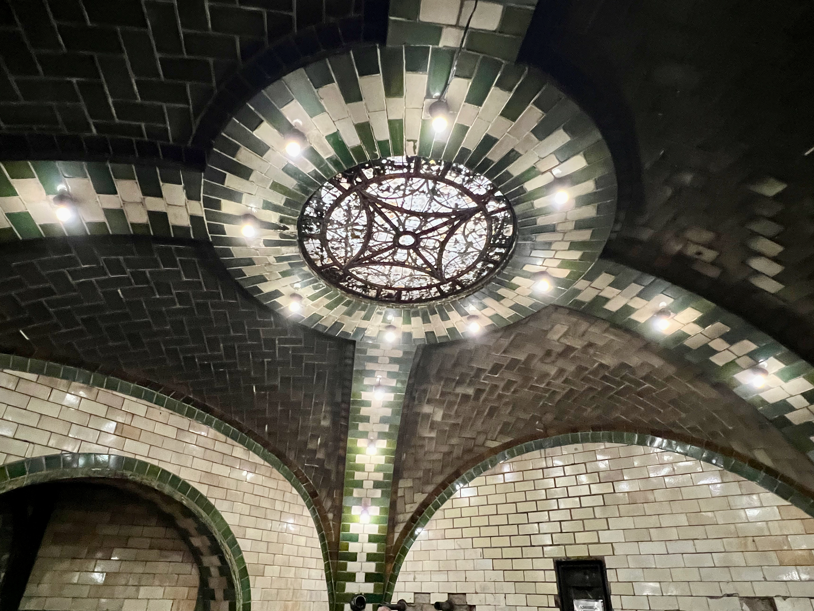 a green and white tiled ceiling