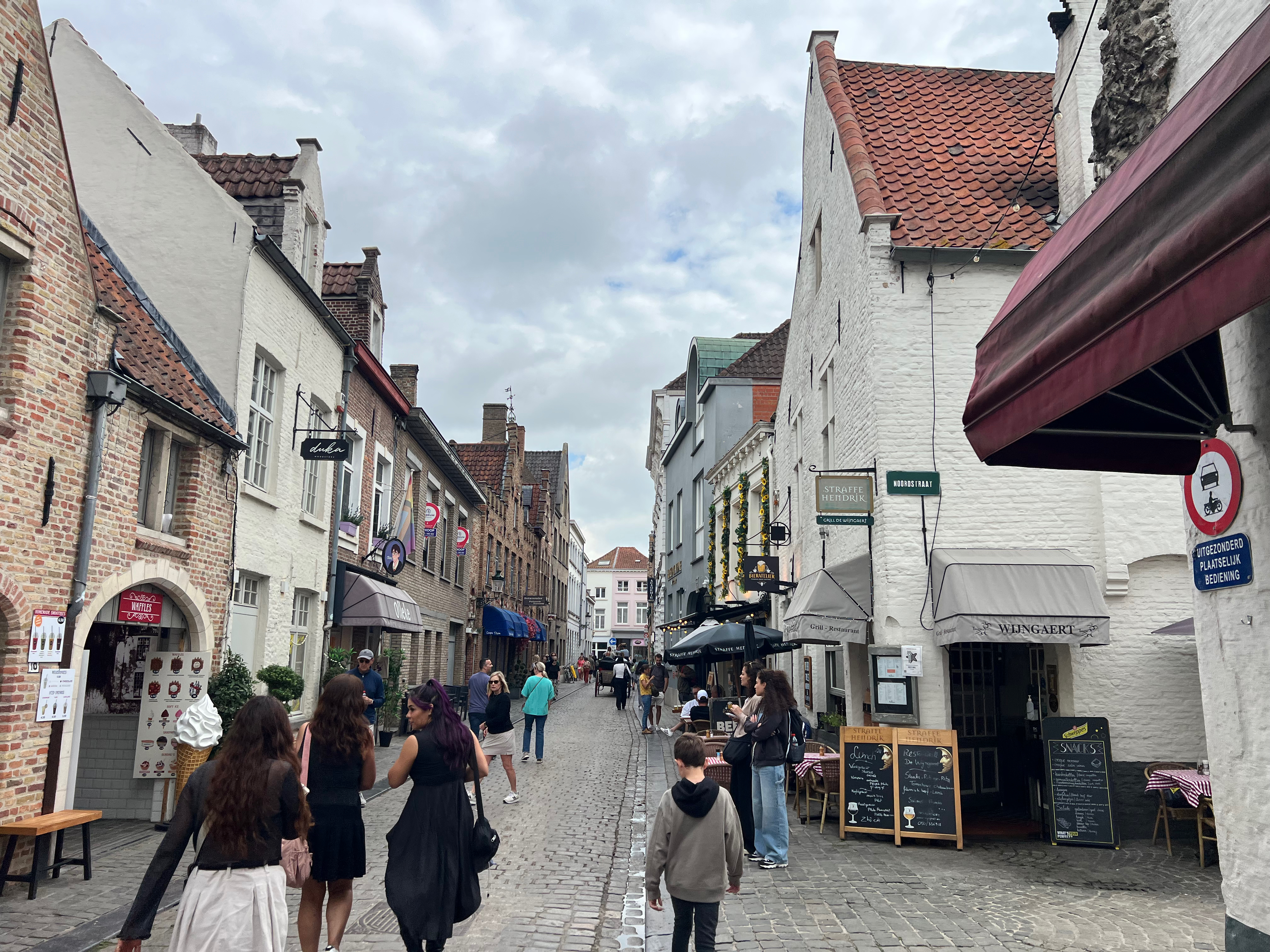 a group of people walking down a street