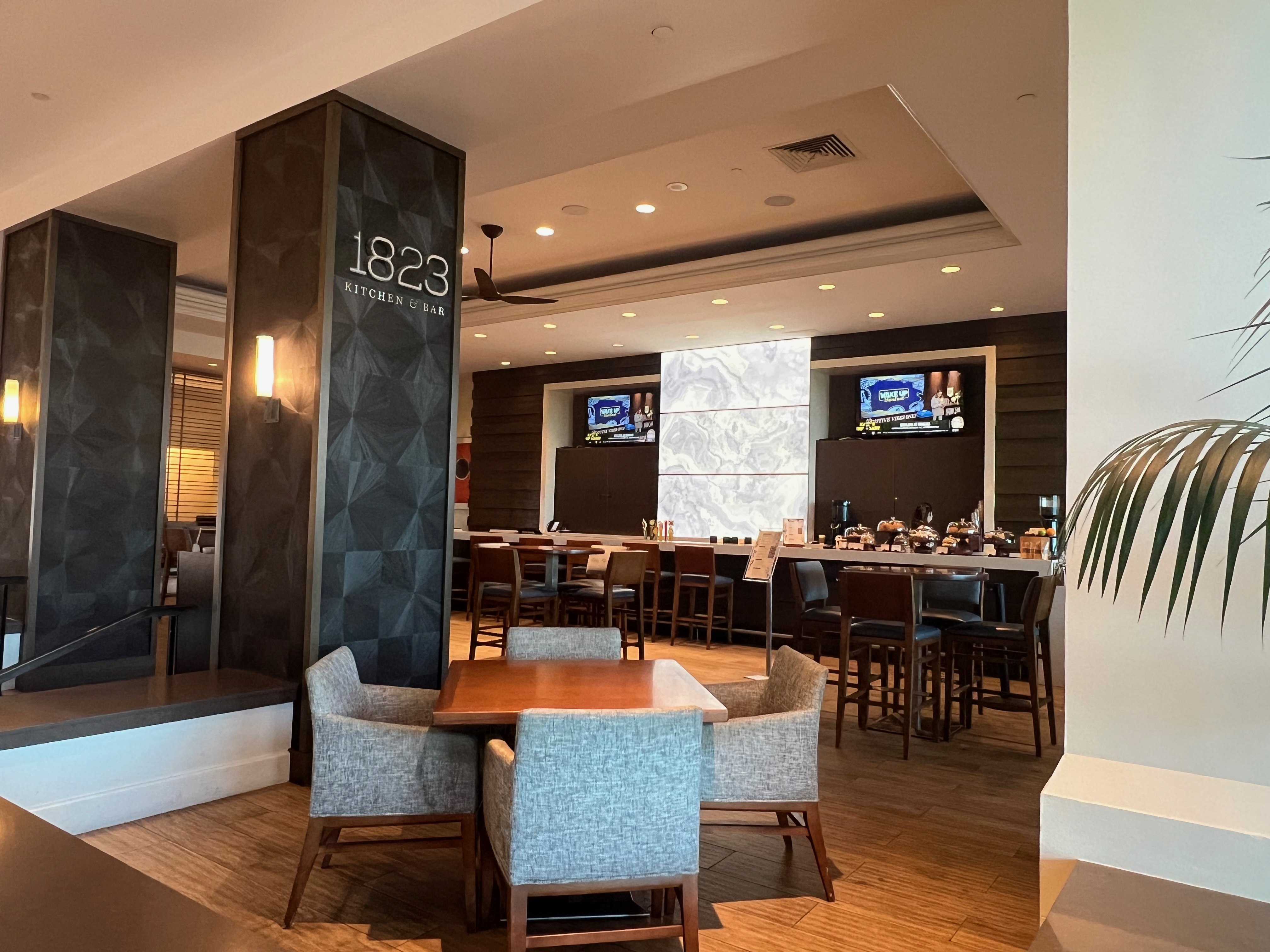 Seating area at 1823 Kitchen & Bar in the Grand Hyatt Tampa Bay lobby