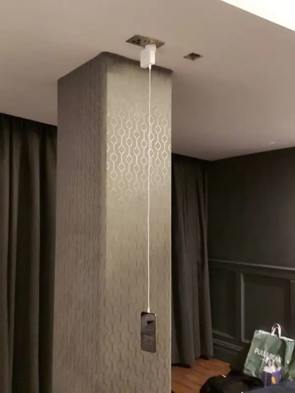 a phone charging on a wall