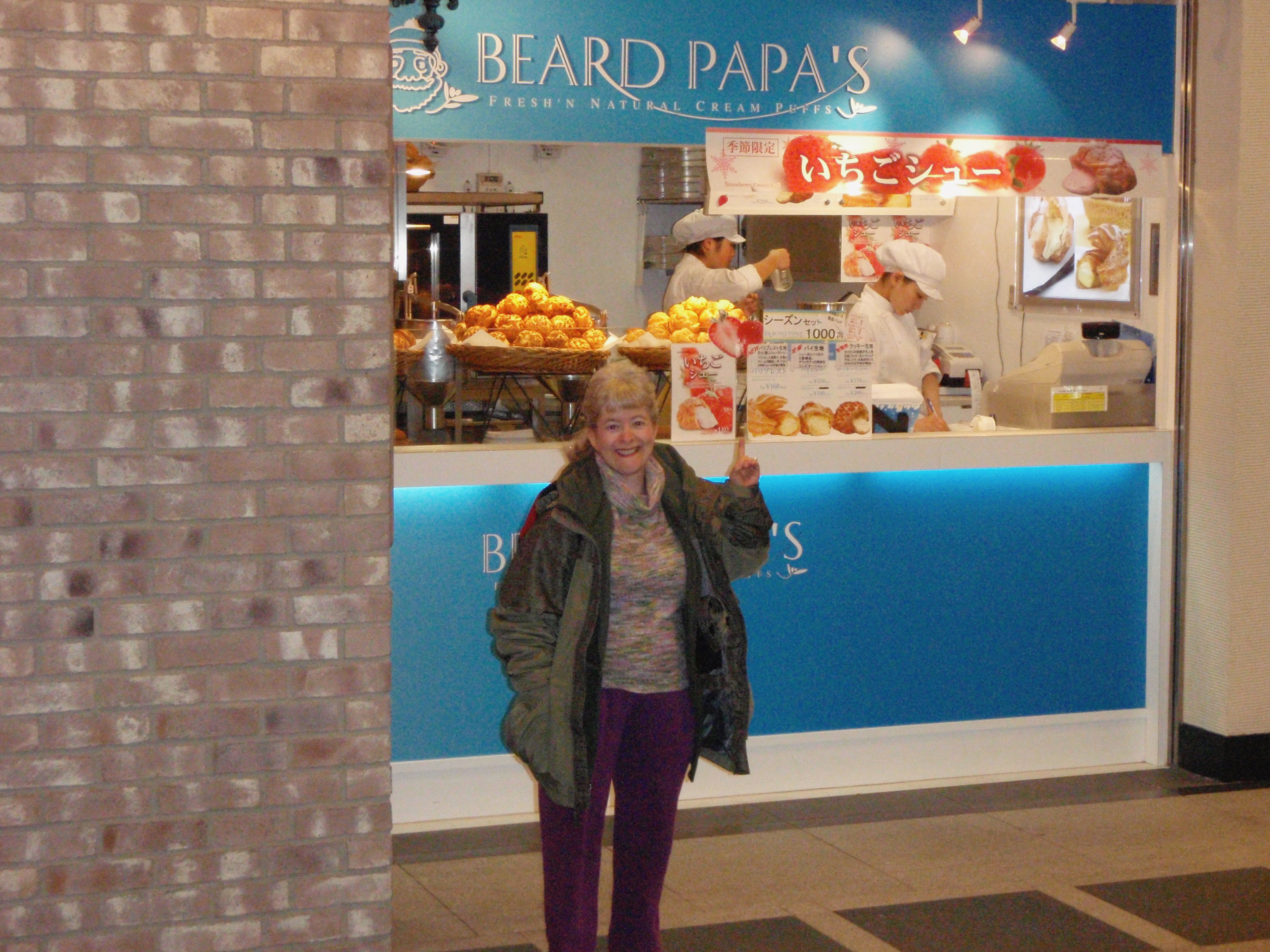 a woman standing in front of a store
