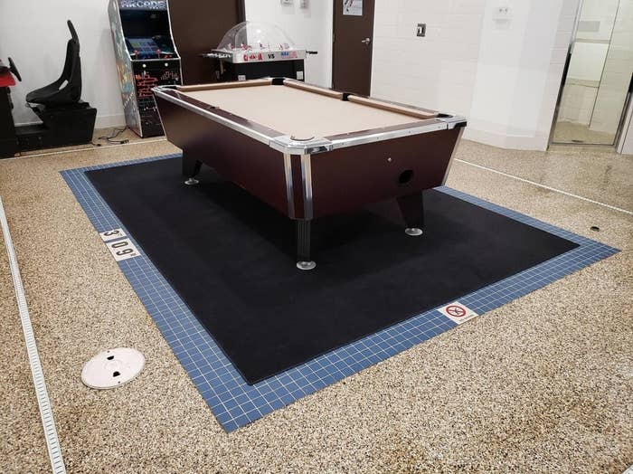 a pool table on a rug