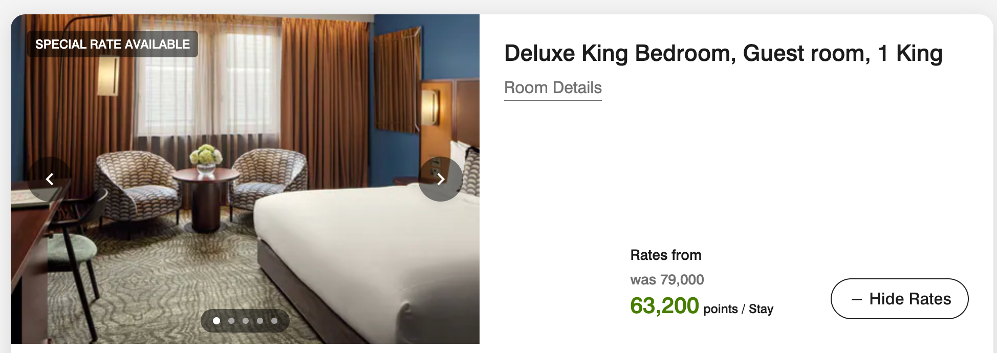 a bed with white sheets and a brown curtain