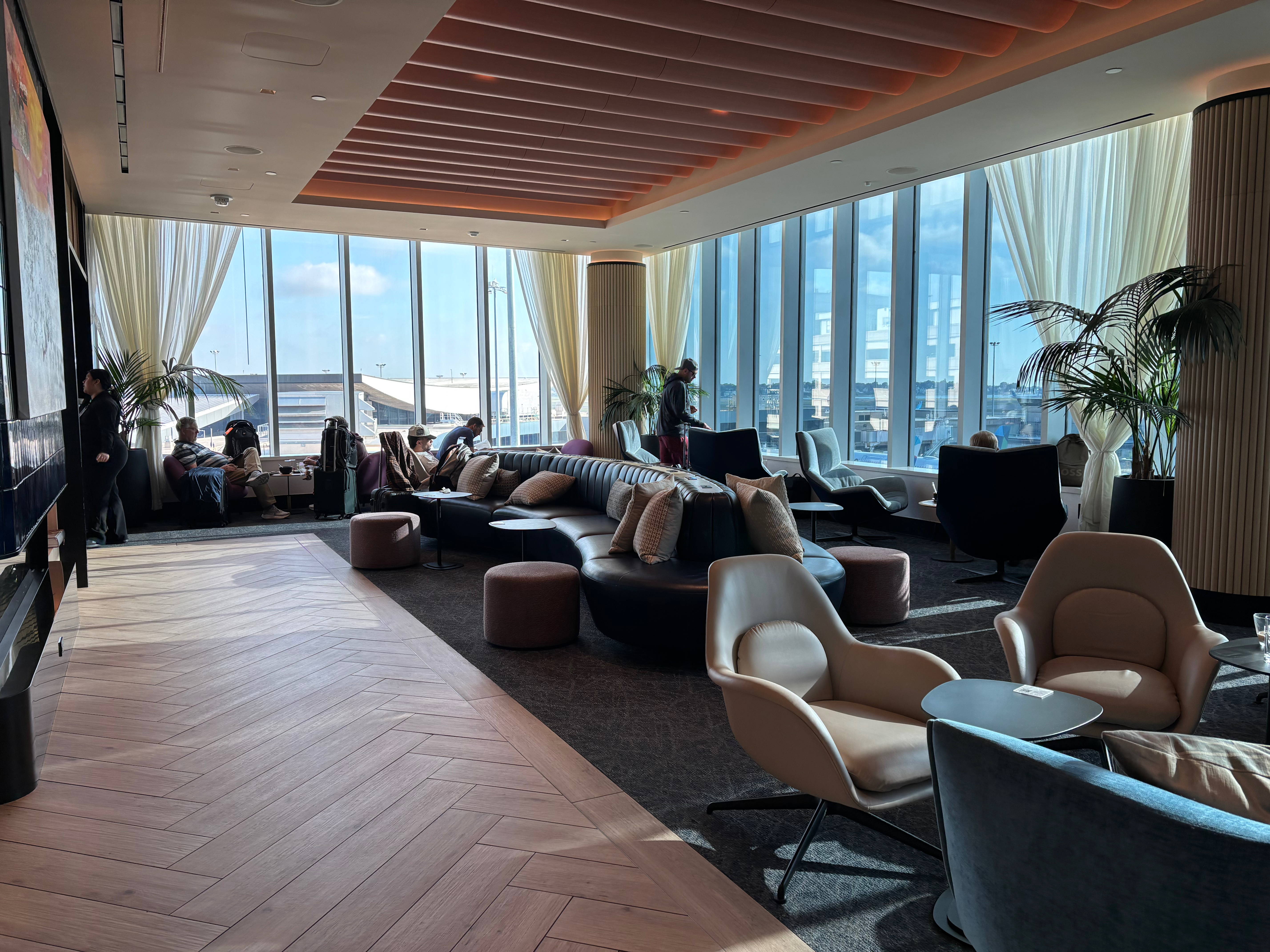 a room with large windows and a large couch