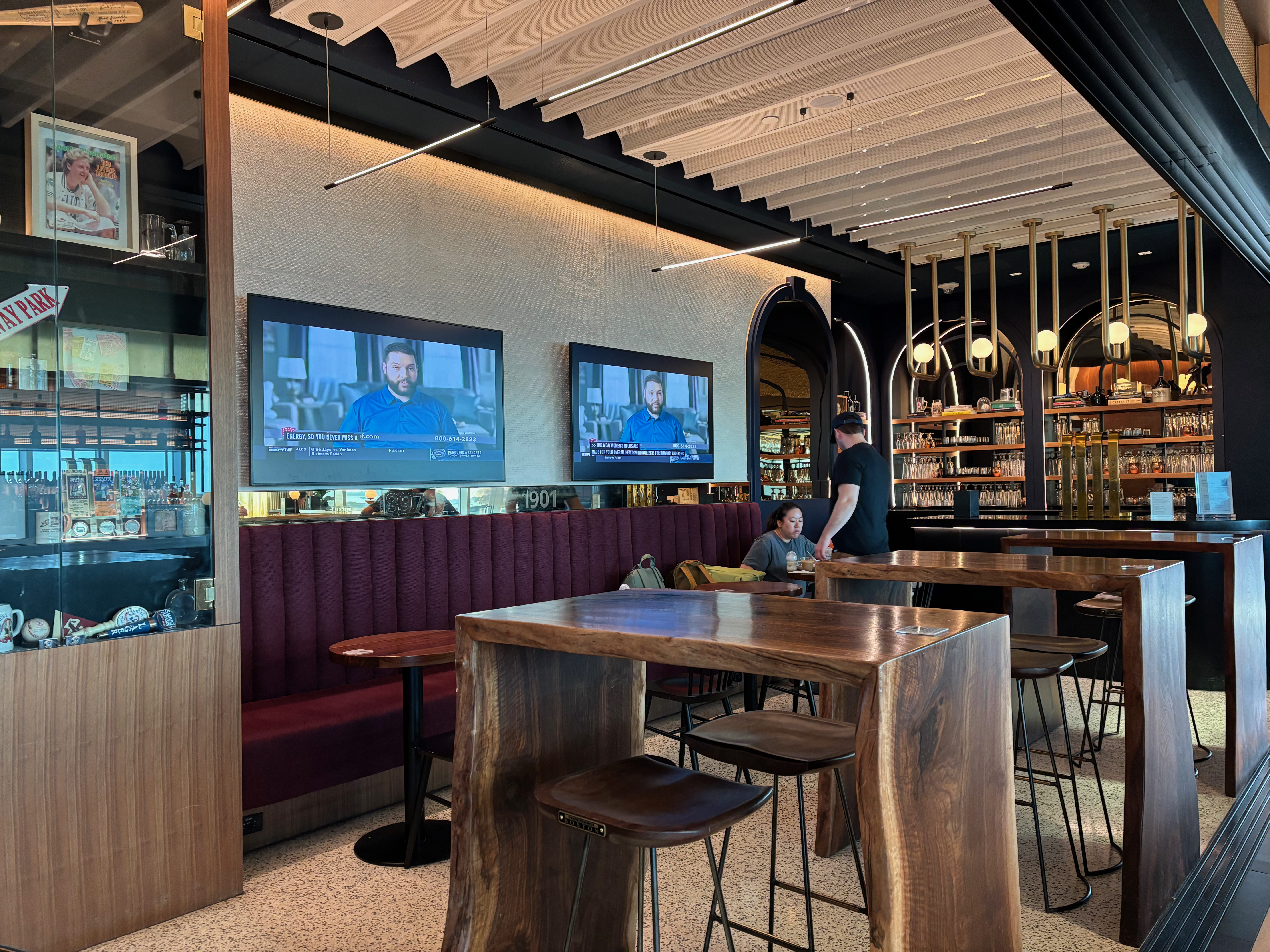 a room with tables and chairs and televisions