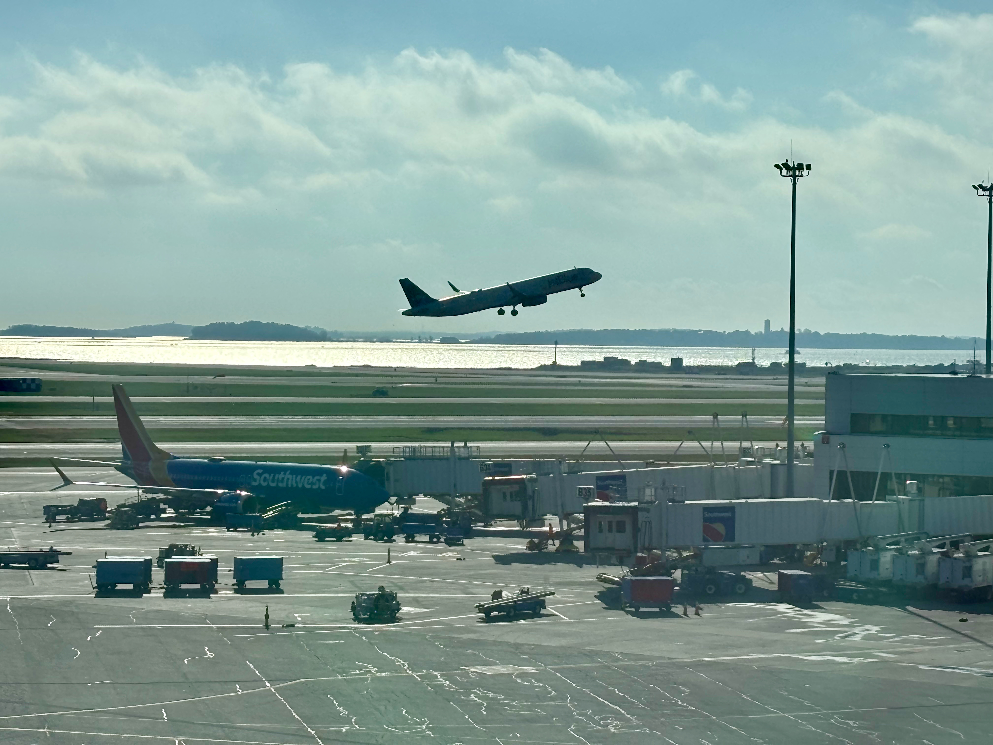 an airplane flying over an airport