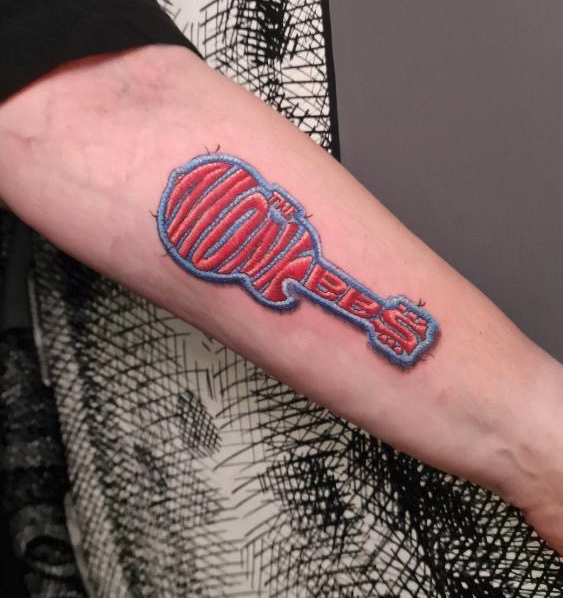 a person's arm with a tattoo on it