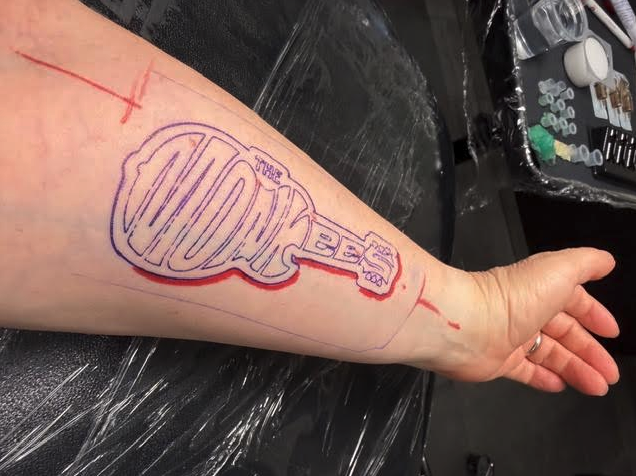a person's arm with a tattoo on it