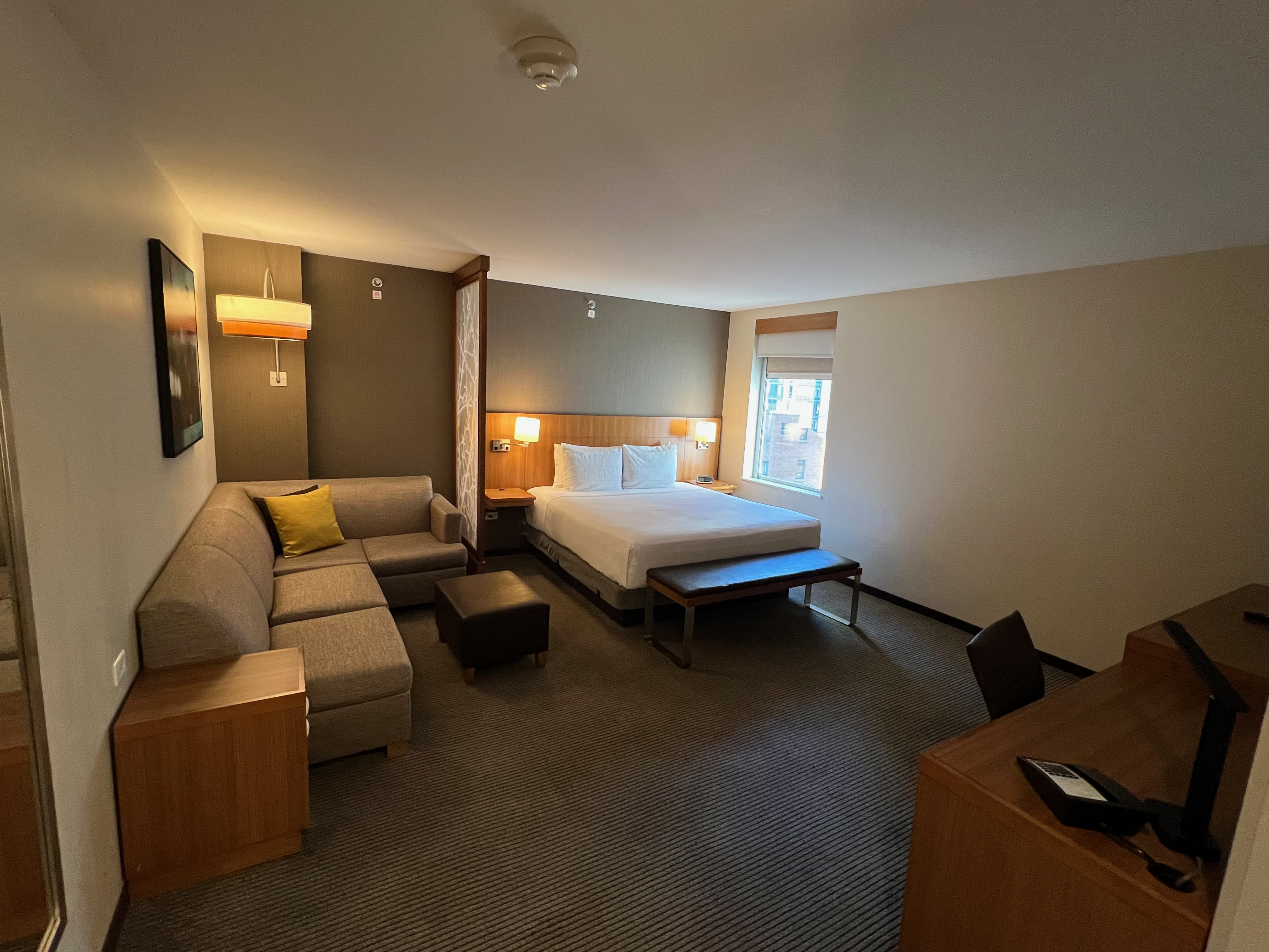 a room with a bed and couch