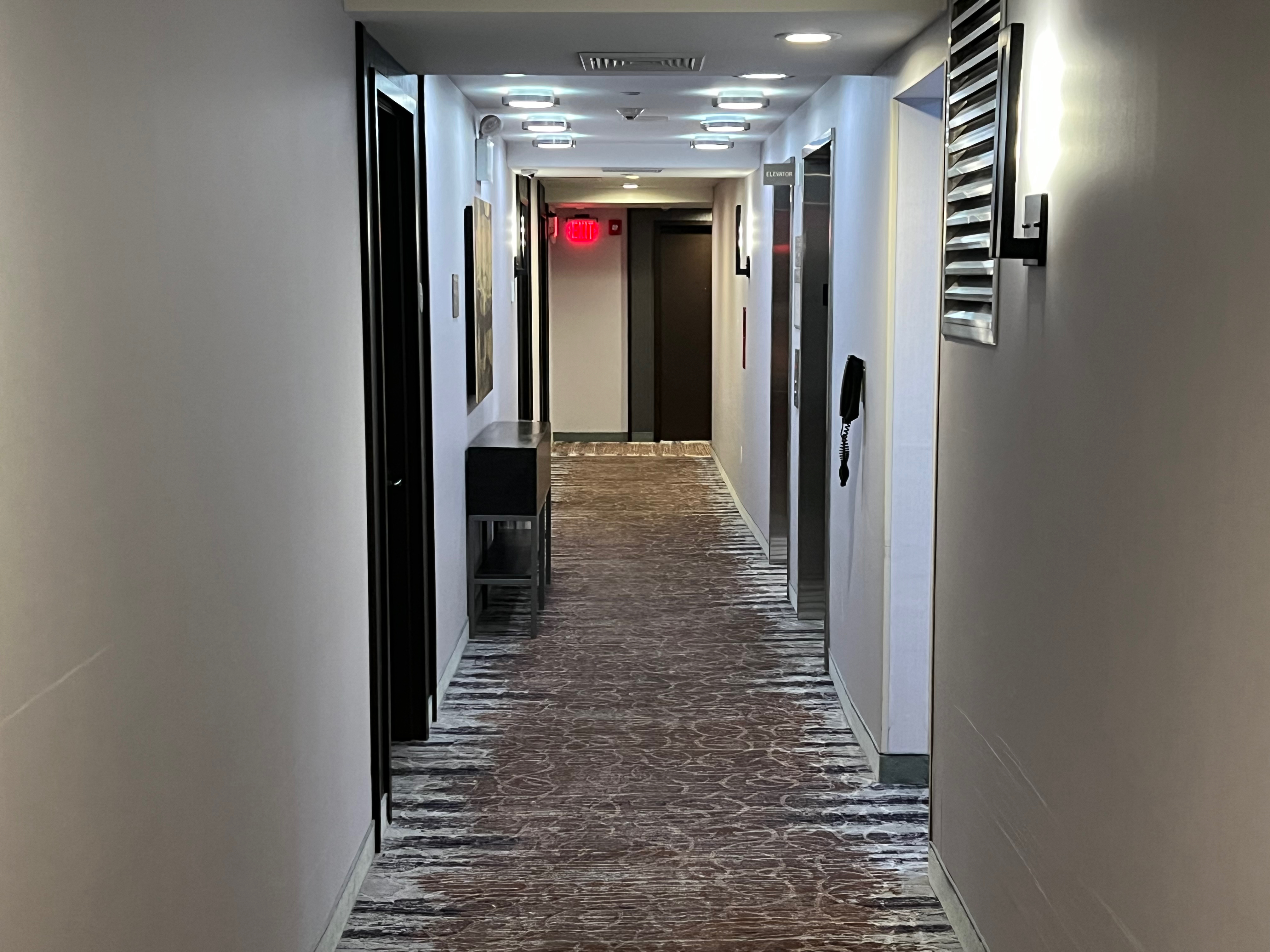 a hallway with a red light