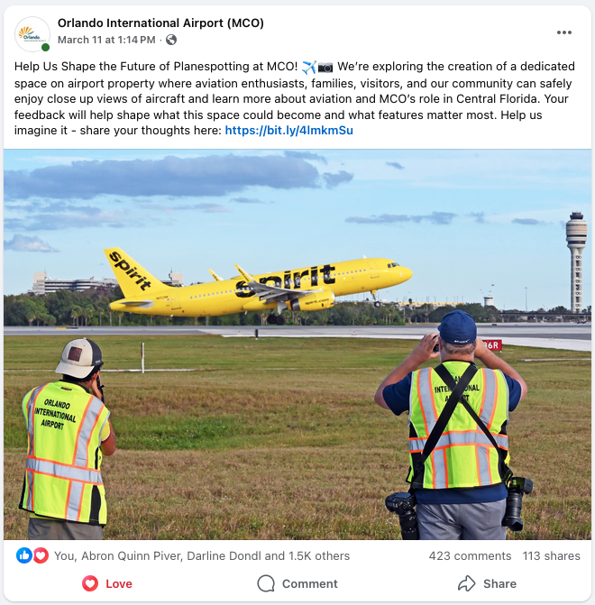 a group of men looking at an airplane