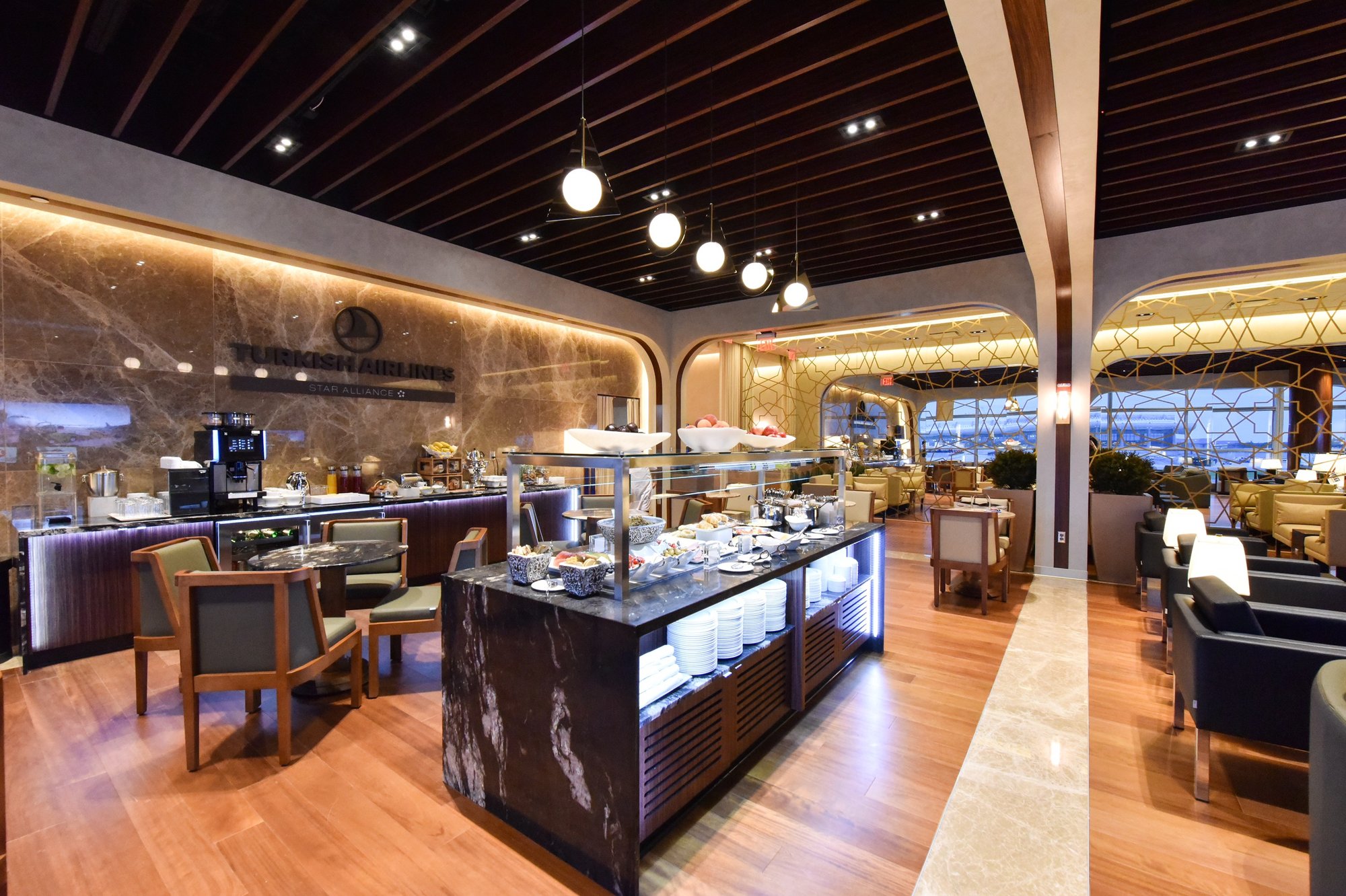 a restaurant with a buffet and chairs